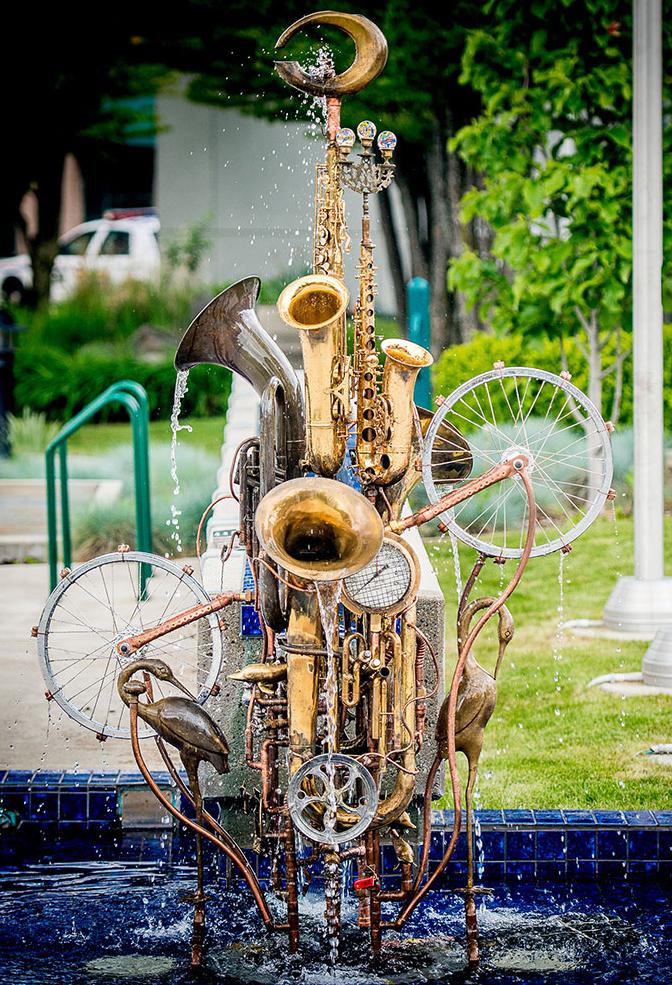 Water fountain sculpture, City Hall, Castlegar, BC.  This musical instrument fountain sculpture was the recipient of the Castlegar Sculpture Walk 2013 People’s Choice award and purchased by the city. Its permanent home is in front of City Hall in Castlegar. Materials include copper tube, upcycled musical instruments, tubas, trumpets, a trombone, bicycle wheels, brass and glass pieces.